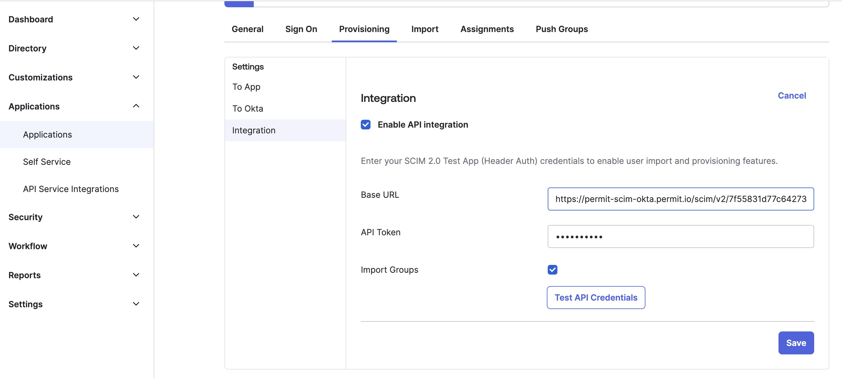 Okta Provisioning Integration settings with Enable API integration checked, the Base URL and API Token fields filled in, and the Test API Credentials button